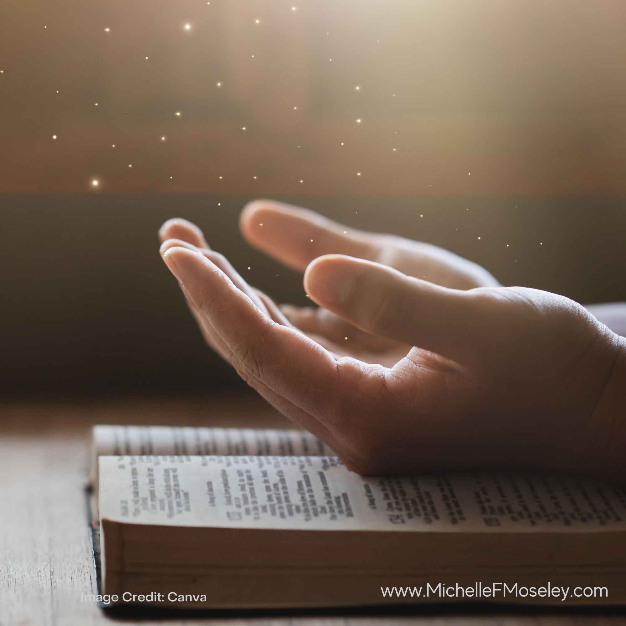 Hands open over Bible with sunlight streaming into scene.